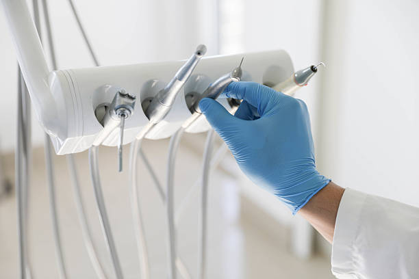 Professional Invisalign Clear Aligners technician working in Mora County County, NM